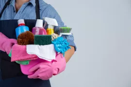 young-girl-is-holding-cleaning-product-gloves-rags-basin-white-wall.jpg